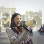 Photo by Andrea Piacquadio: https://www.pexels.com/photo/cheerful-young-woman-screaming-into-megaphone-3761509/